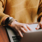 woman typing on computer